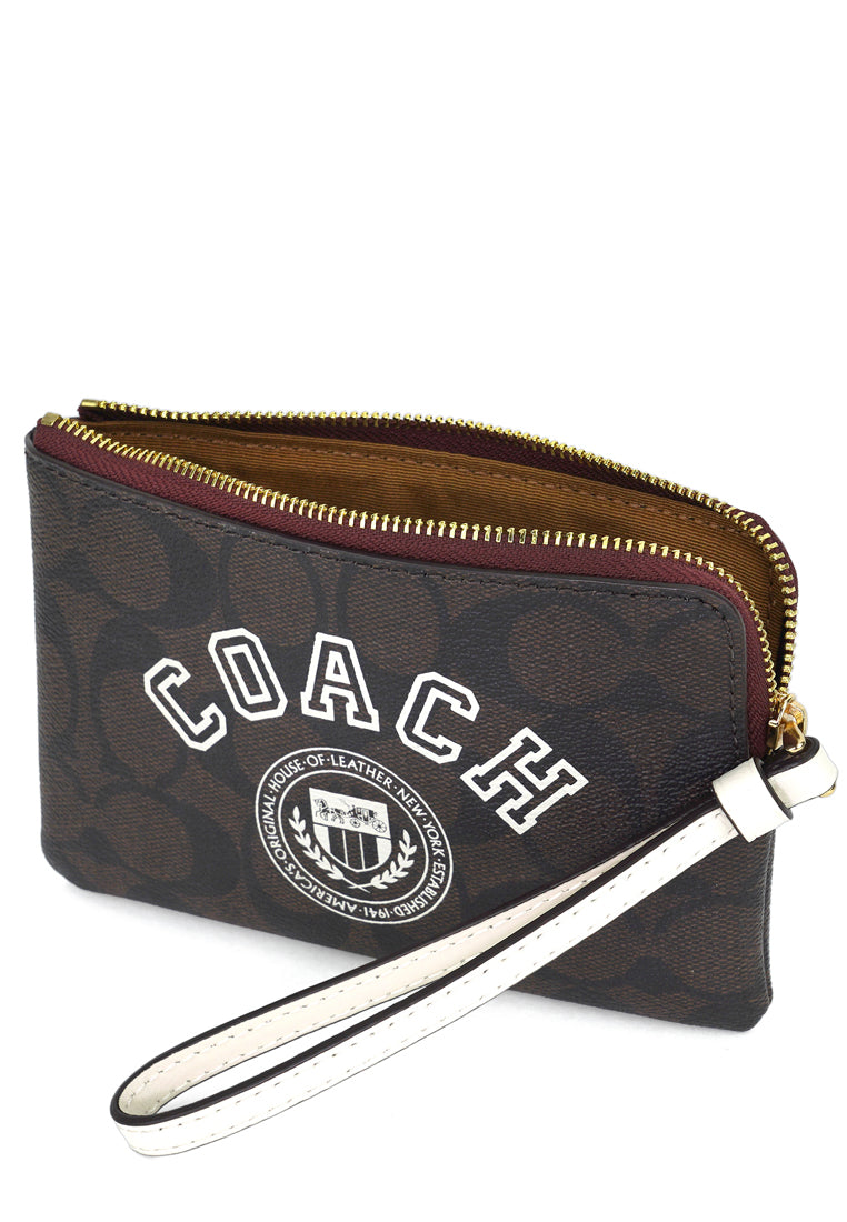 Coach Corner Zip Wristlet In Signature Canvas With Varsity Motif - Dark Brown/White