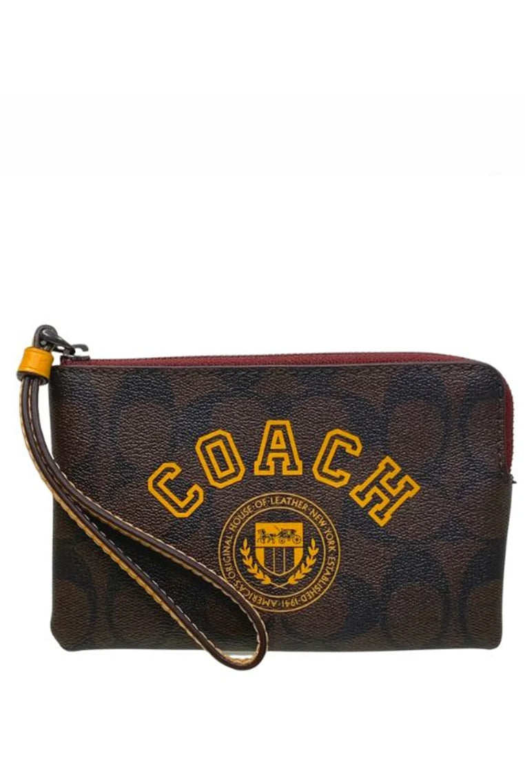 Coach Corner Zip Wristlet In Signature Canvas With Varsity Motif - Dark Brown/Yellow