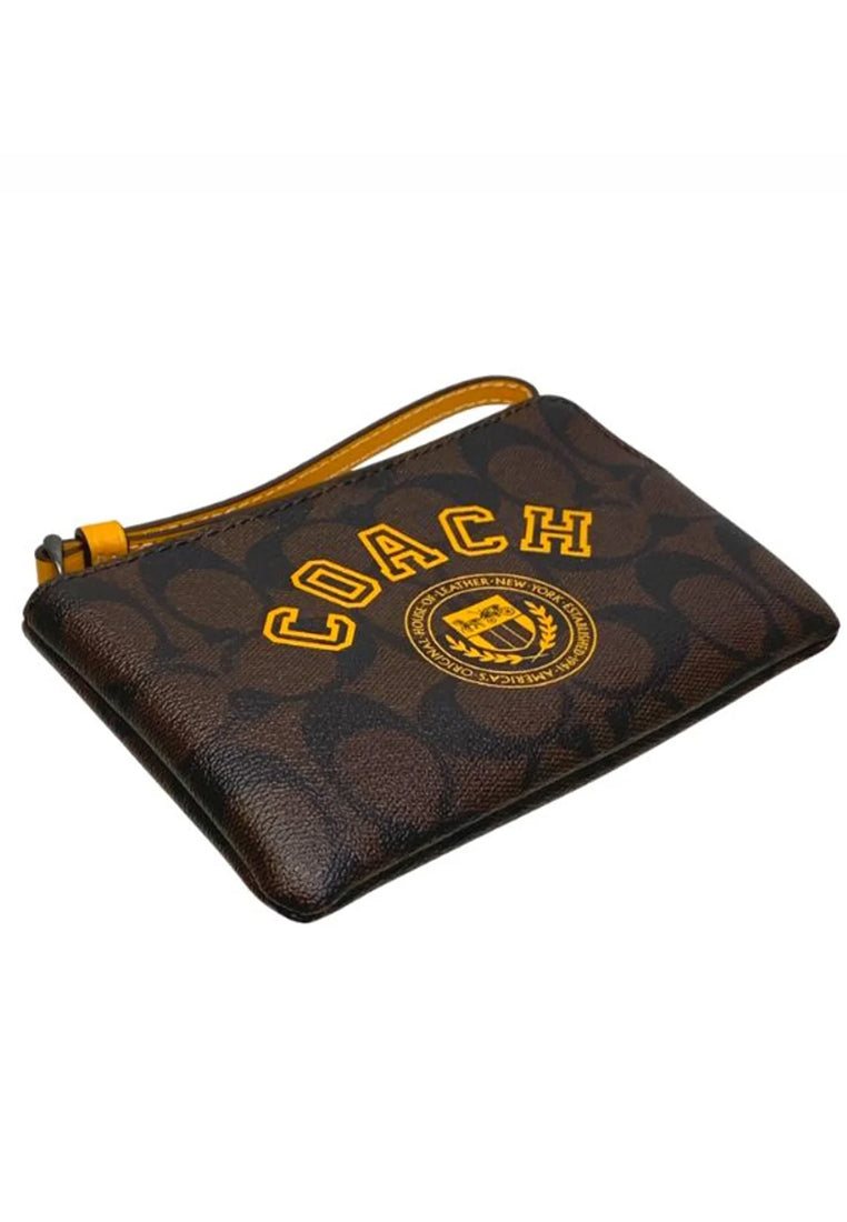 Coach Corner Zip Wristlet In Signature Canvas With Varsity Motif - Dark Brown/Yellow